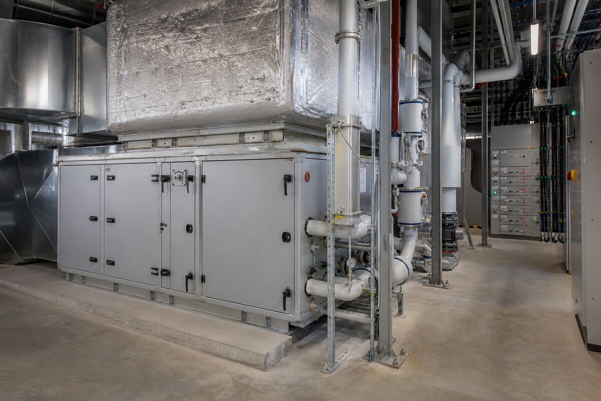 Building MEP plant room with HVAC, electrical panels, and facility management equipment