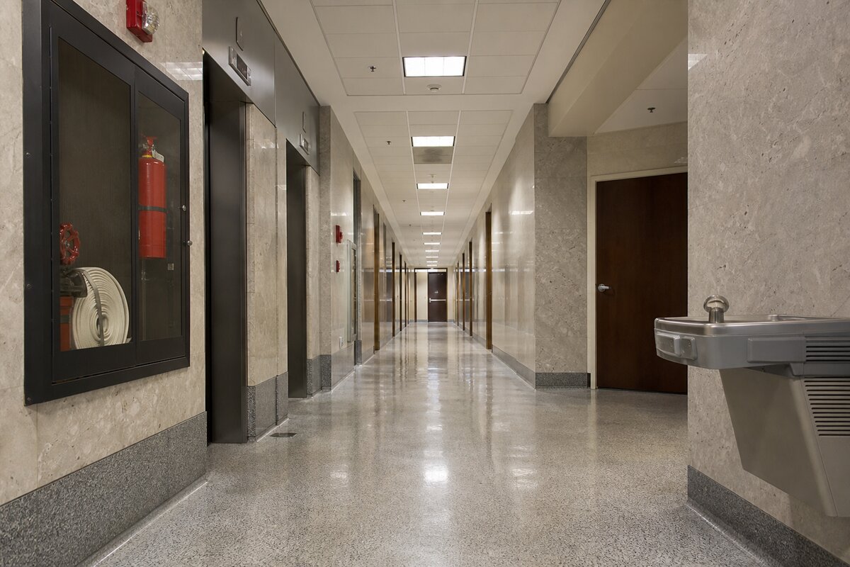 Empty civic building corridor with public facilities equipment along a government office hallway